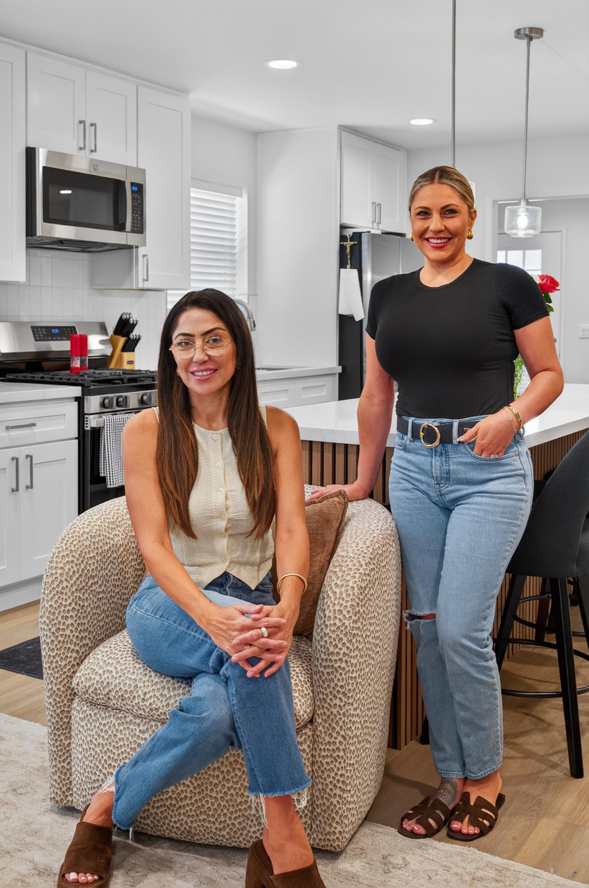The Mejia Team in a remodeled white kitchen